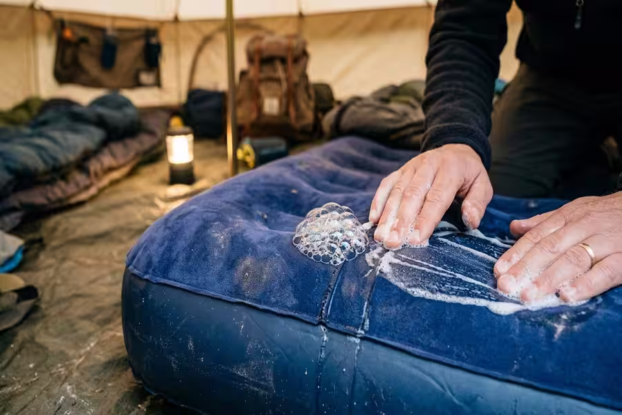Soap bubbles indicating a leak on an air mattress