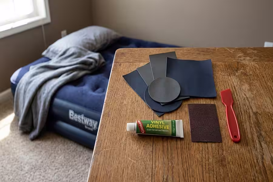 Different tools and patch kits used for repairing inflatable beds